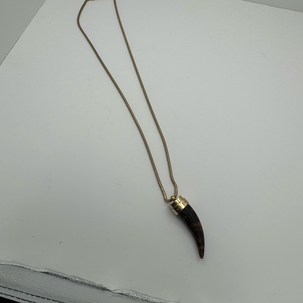 Micheal Kors Gold/Tortoise tooth necklace.